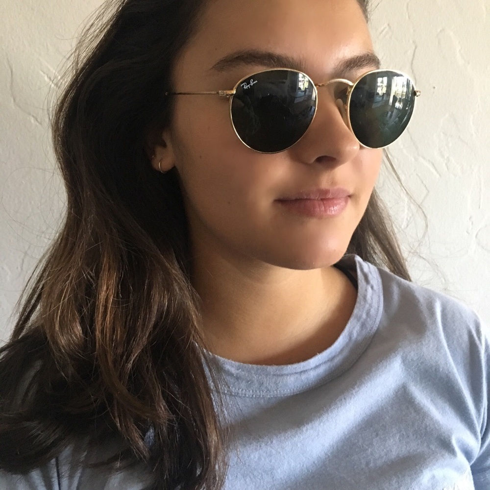 Raybans: dark green and gold frame. RB3447
